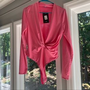 Pink long sleeve low cut bodysuit. Size L